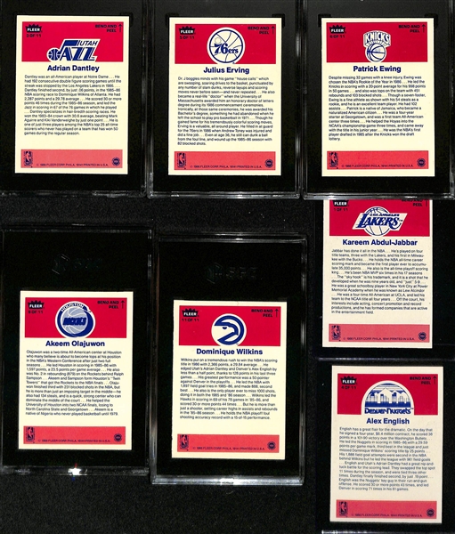 1986-87 Fleer Basketball Partial Sticker Set (7 of 11 stickers) inc. 5 Graded (Adrian Dantley SGC 8, Julius Erving SGC 8.5, Patrick Ewing SGC 7, Dominique Wilkins SGC 7.5, Akeem Olajuwon SGC 8.5) -...