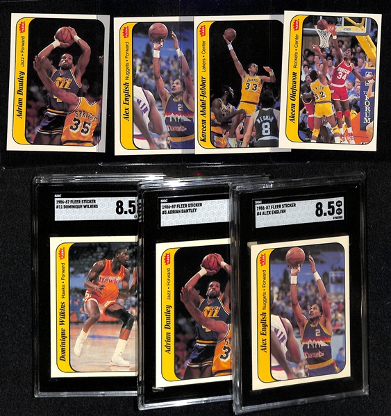 (7) 1986-87 Fleer Basketball Stickers inc. Olajuwon, Abdul-Jabbar & 3 Graded (Alex English SGC 8.5, Adrian Dantley SGC 8, Dominique Wilkins SGC 8.5) - Inc. Duplicates of Dantley & English.
