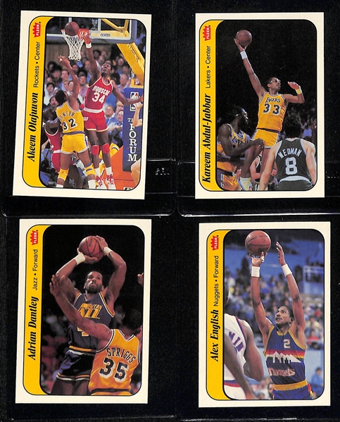 (7) 1986-87 Fleer Basketball Stickers inc. Olajuwon, Abdul-Jabbar & 3 Graded (Alex English SGC 8.5, Adrian Dantley SGC 8, Dominique Wilkins SGC 8.5) - Inc. Duplicates of Dantley & English.