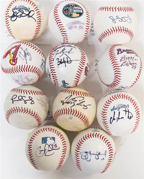 Lot of (11) Signed Baseballs (Cardinals and Braves) inc. A. Galaraga, J. Oquendo, Rasmus, Taguchi, B. McCann