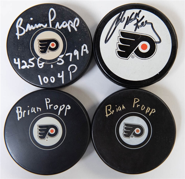 Lot of 4 Flyers Signed Hockey Pucks w. Bob Kelly