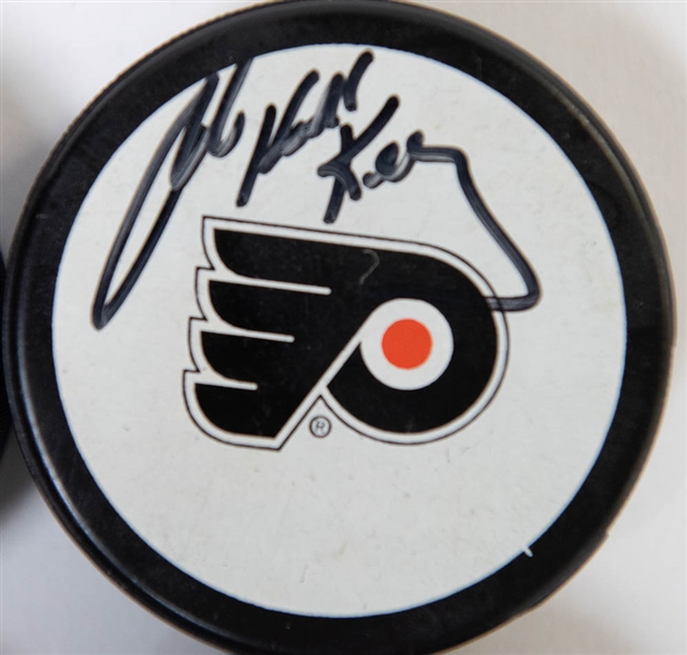 Lot of 4 Flyers Signed Hockey Pucks w. Bob Kelly