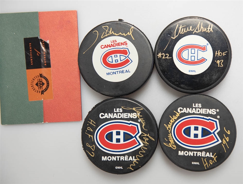Lot of (4) Signed Montreal Canadiens Hockey Pucks (Steve Schutt, Jacques Laperriere, Henri Richard, Emile Bouchard)  - JSA Auction Letter