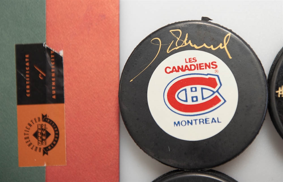 Lot of (4) Signed Montreal Canadiens Hockey Pucks (Steve Schutt, Jacques Laperriere, Henri Richard, Emile Bouchard)  - JSA Auction Letter
