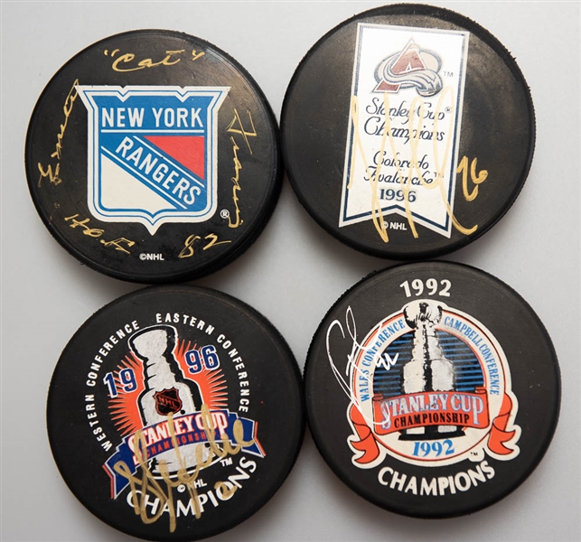 Lot of (4) Signed Hockey Pucks (Rick Tocchet, Emile Cat Francis, Sylvain Lefebvre, and one other)  - JSA Auction Letter