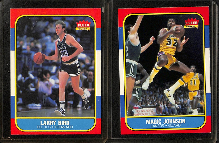 Lot of (7) 1986-87 Fleer Basketball Cards (Malone RC, Wilkins RC, Bird, Magic, Jabbar #1, Mullin RC, Walton)