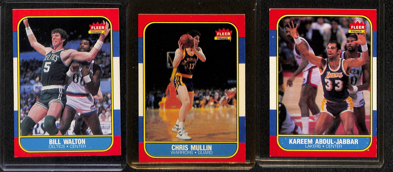 Lot of (7) 1986-87 Fleer Basketball Cards (Malone RC, Wilkins RC, Bird, Magic, Jabbar #1, Mullin RC, Walton)
