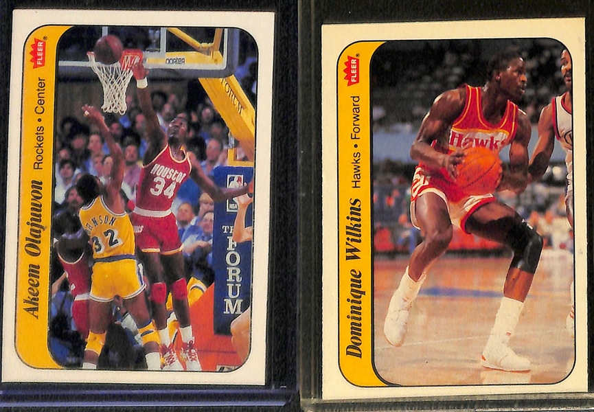 Lot of (10) 1986 Fleer Basketball Stickers Inc. Bird, Ewing, Jabbar, Magic, Olajuwon, Wilkins and More