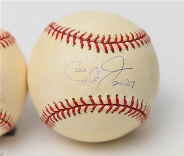 Lot of (2) Autographed Baseballs w/ Cal Ripken Jr. and Chipper Jones (JSA and PSA/DNA Authenticated)