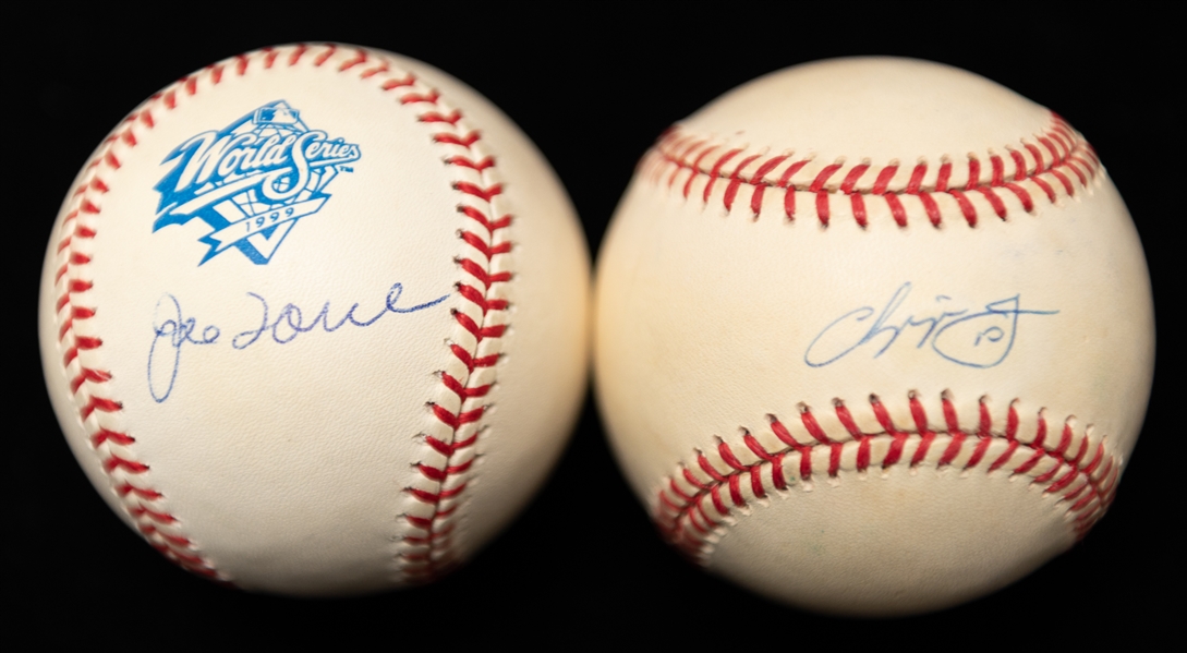 Lot of (2) World Series Autographed Baseballs w. Chipper Jones and Joe Torre (JSA Auction Letter)