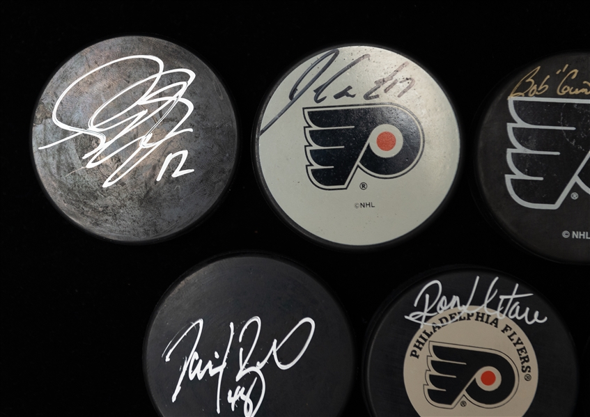 Lot of (9) Autographed Hockey Pucks of Philadelphia Flyers w. Leclair, Hextall, Gagne, Schultz and Others (JSA Auction Letter)