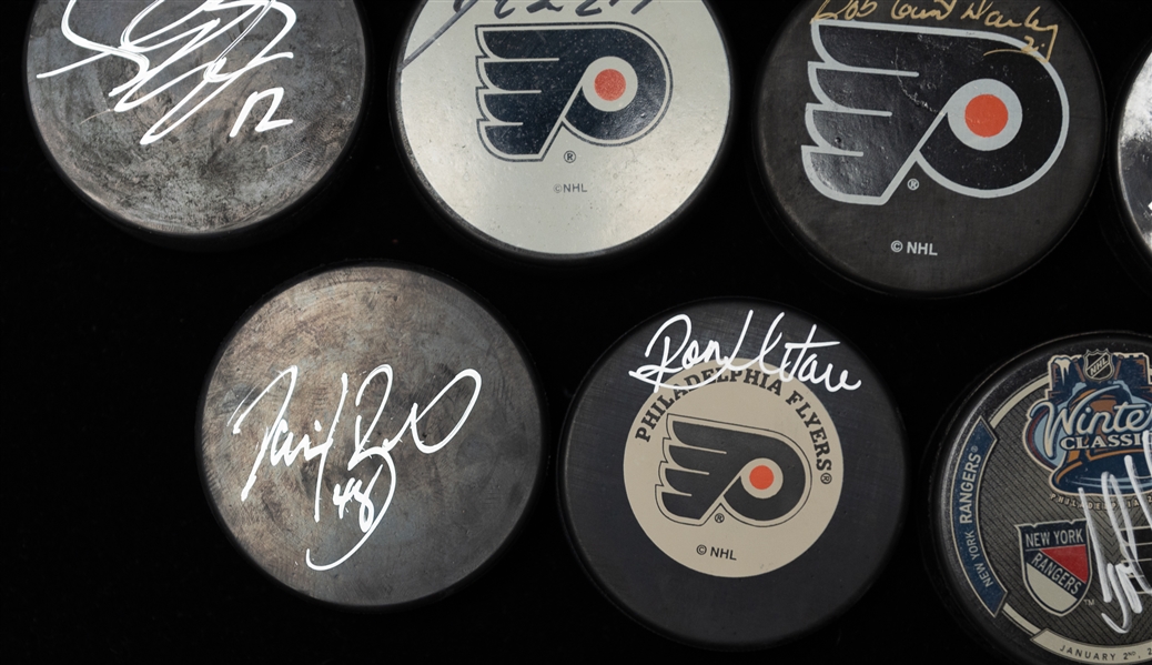 Lot of (9) Autographed Hockey Pucks of Philadelphia Flyers w. Leclair, Hextall, Gagne, Schultz and Others (JSA Auction Letter)