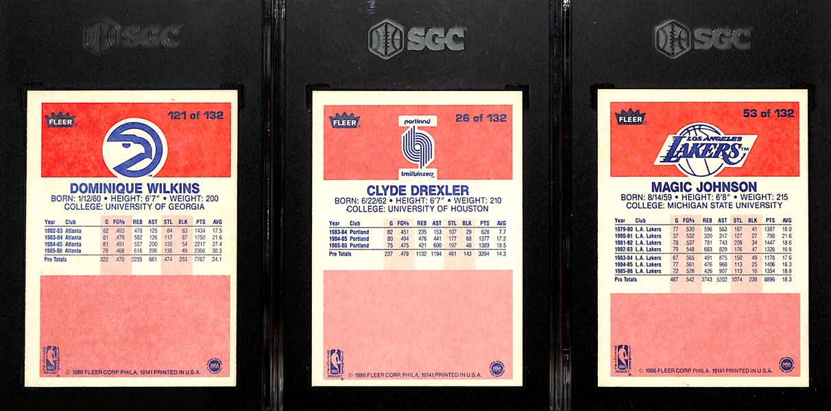Lot of (3) SGC Graded 1986 Fleer Basketball Cards w. Dominique Wilkins # 121 SGC 7, Clyde Drexler # 26 SGC 8 and Magic Johnson # 53 SGC 7.5