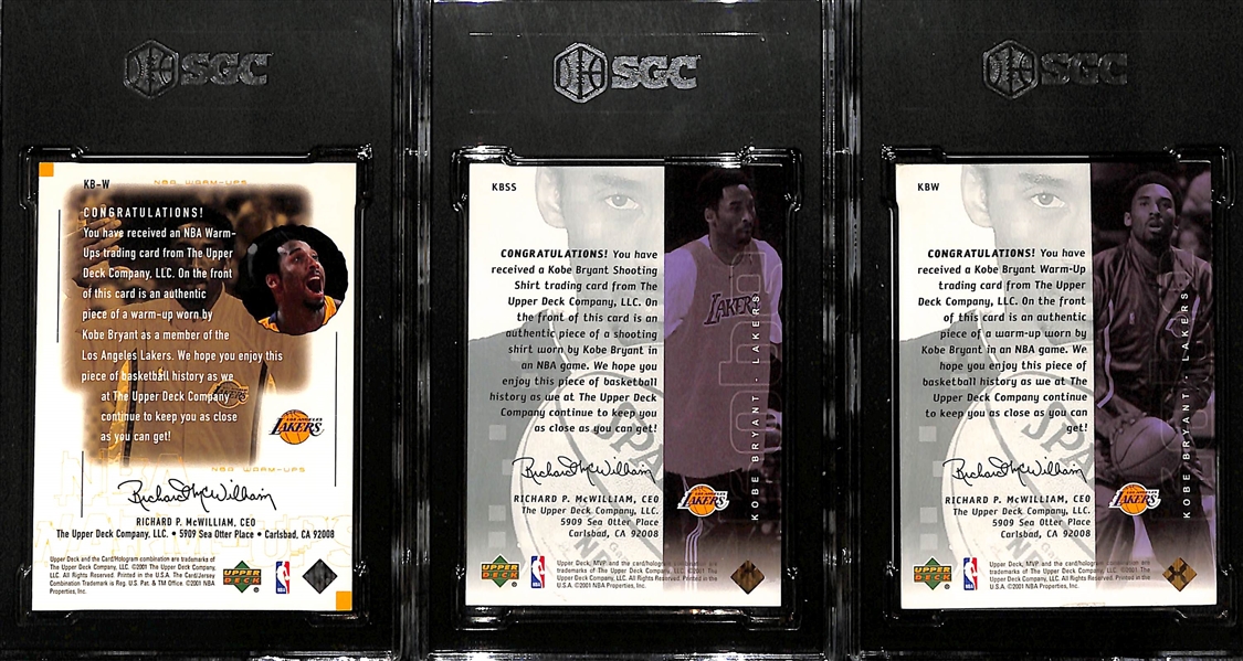 (3) Kobe Bryant Worn Warm Up Relic Cards - 2000 UD Encore NBA Warm-Ups (SGC 9), 2001 UD MVP Shooting Shirt (SGC 8), 2001 UD MVP Warm-Up Material (SGC 6)