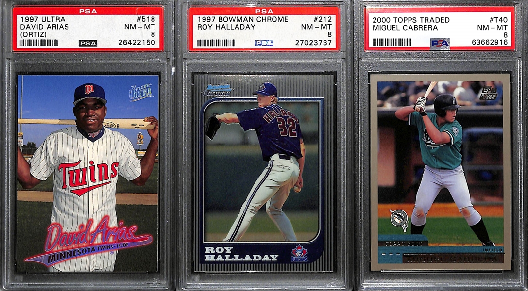 (3) PSA Graded Late 1990s Baseball Superstar and Hall of Fame Rookies- 1997 Fleer Ultra David Ortiz (PSA 8), 1997 Bowman Chrome Roy Halladay (PSA 8), 2000 Topps Traded Miguel Cabrera (PSA 8)