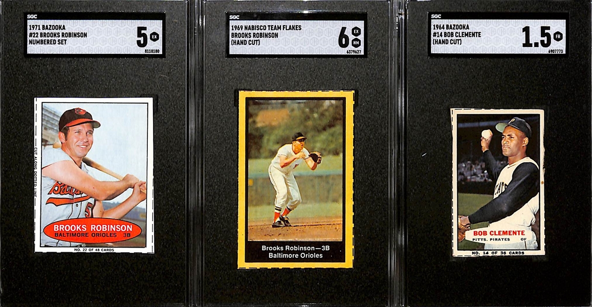 Lot of (3) SGC Graded Baseball Cards Inc. 1964 Bazooka Bob Clemente (Hand Cut) (SGC 1.5), 1969 Nabisco Team Flakes Brooks Robinson (Hand Cut) (SGC 6), and 1971 Bazooka Brooks Robinson Numbered Set...