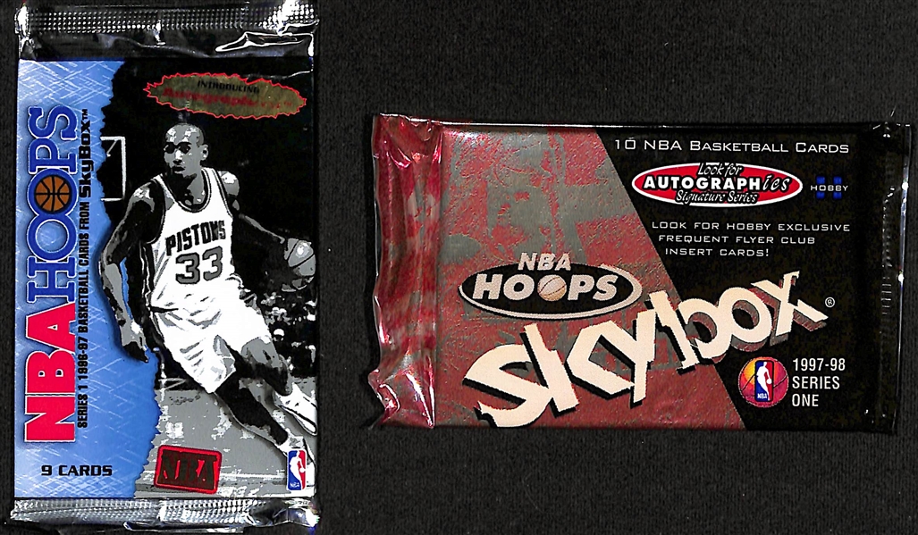 Lot of (21) 1996-97 NBA Hoops Sealed Basketball Packs (Kobe Bryant Rookie Year!) and (3) 1997-98 Sealed NBA Hoops Skybox Series 1 Sealed Packs