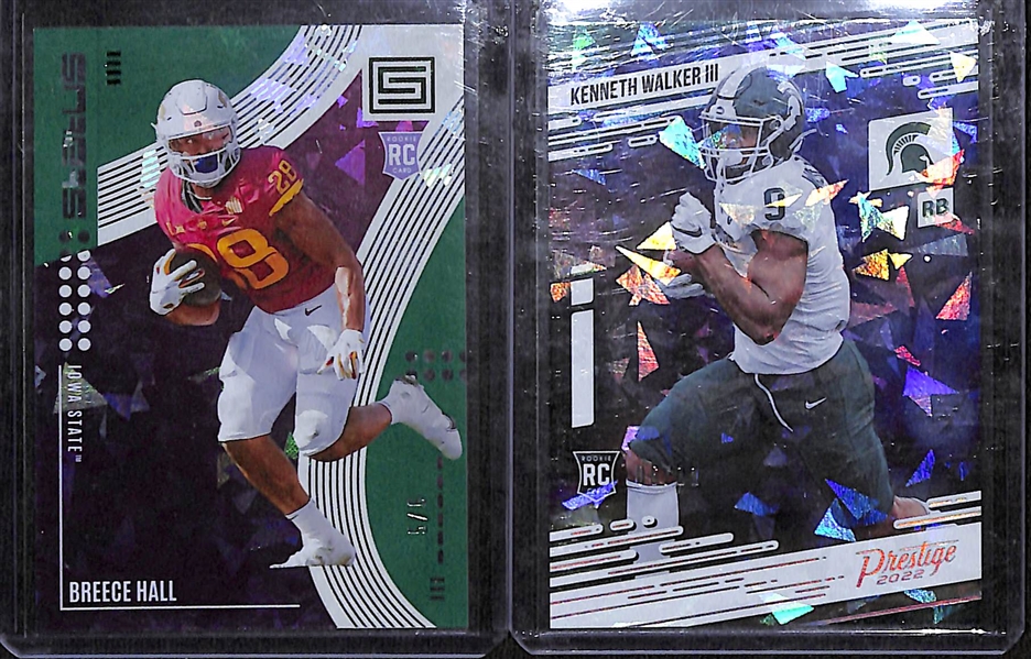 Lot of (7) 2022 Chronicles Draft Picks Cracked Ice First of the Line Exclusive inc. Status Breece Hall Rookie Green (#/6), Prestige Kenneth Walker Rookie (#/11), Phoenix Jameson Williams Rookie...