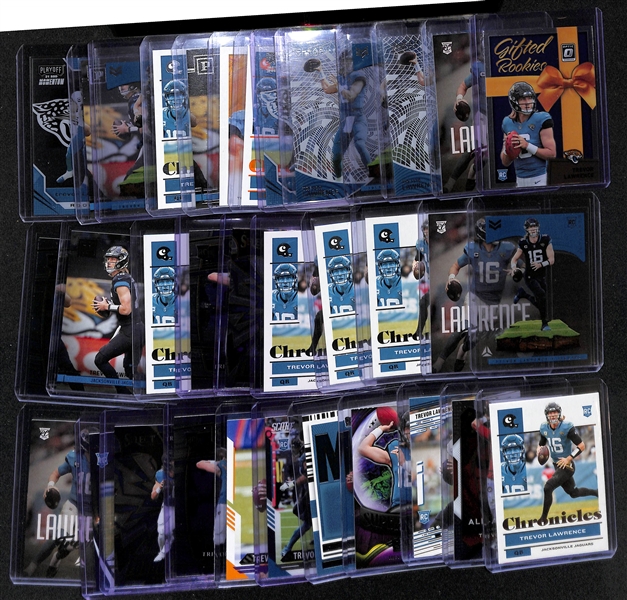 Lot of (34) Trevor Lawrence Rookie Cards inc. Donruss Optic Gifted Rookies, Chronicles Luminance Pink, Chronicles Clear Vision, Chronicles Magnitude, Chronicles Playoff Momentum, Chronicles Orange, +