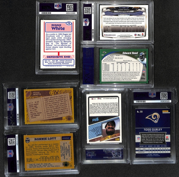 Lot of (7) PSA Graded Hall of Fame and Star Football Cards w/ Mostly Rookies inc. 1985 Topps USFL Reggie White (PSA 9), 2002 Topps Ed Reed Rookie (PSA 9), 2014 Topps Chrome Aaron Donald Pulsar...