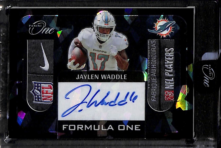 Lot of (3) Miami Dolphins Autograph Cards inc. 2022 Panini One Jaylen Waddle Formula One Tag Patch Black Ice (#/5), 2022 Panini One Zach Thomas/Jason Taylor Dual Plus One Signatures (#/20), 2022...