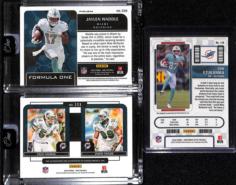 Lot of (3) Miami Dolphins Autograph Cards inc. 2022 Panini One Jaylen Waddle Formula One Tag Patch Black Ice (#/5), 2022 Panini One Zach Thomas/Jason Taylor Dual Plus One Signatures (#/20), 2022...