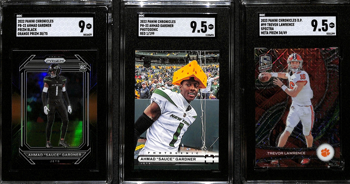 Lot of (3) SGC Graded Football Cards inc. 2022 Chronicles Prizm Black Ahmad Sauce Gardner Orange Rookie (SGC 9) (#/75), 2022 Chronicles Photogenic Ahmad Sauce Gardner Red Rookie (SGC 9.5) (#/199), +