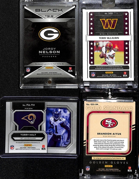 Lot of (4) Autograph Football Cards- 2023 Panini Black Jordy Nelson (#/99), 2022 Panini One Terry McLaurin Patch (#/35), 2022 Prizm Torry Holt (#/149), 2021 Gold Standard Brandon Aiyuk (#/99)