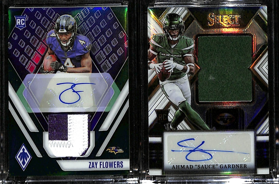 Lot of (2) Football Rookie Patch Autographs- 2023 Phoenix Zay Flowers (#/25), 2022 Select Ahmad Sauce Gardner (#/75)