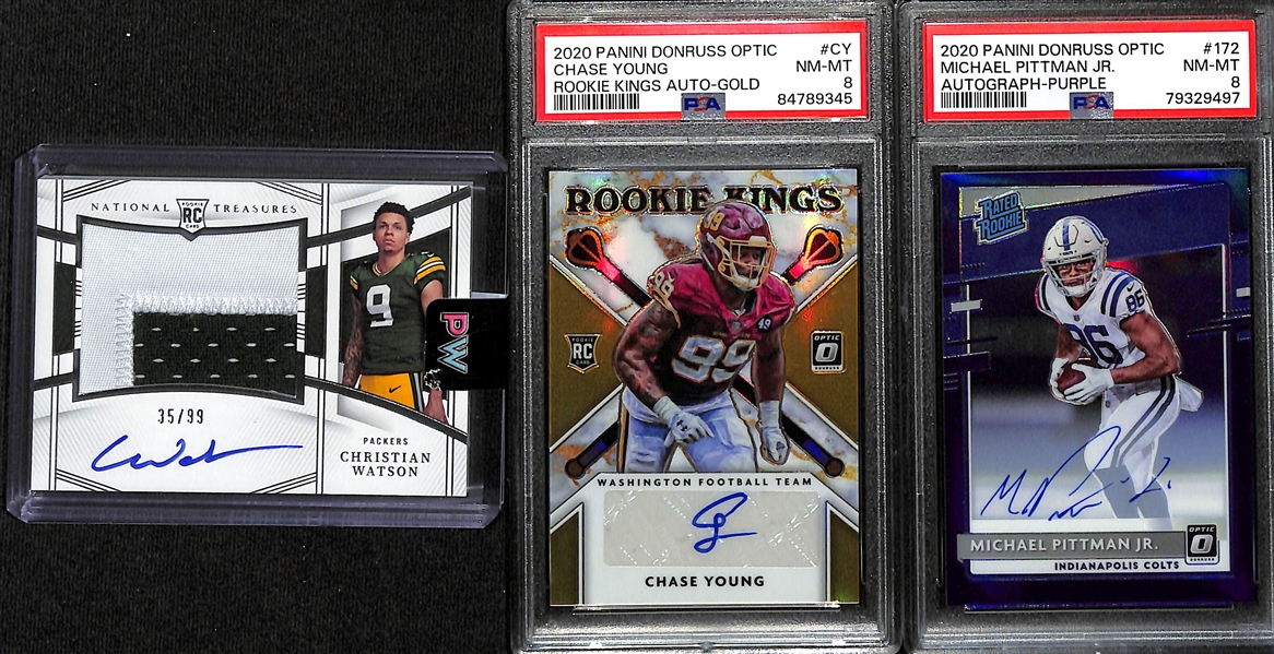 Lot of (3) Football Rookie Autograph Cards- 2022 National Treasures Christian Watson Patch (#/99), 2020 Donruss Optic Michael Pittman Jr Purple (PSA 8) (#/35), 2020 Donruss Optic Chase Young Rookie...