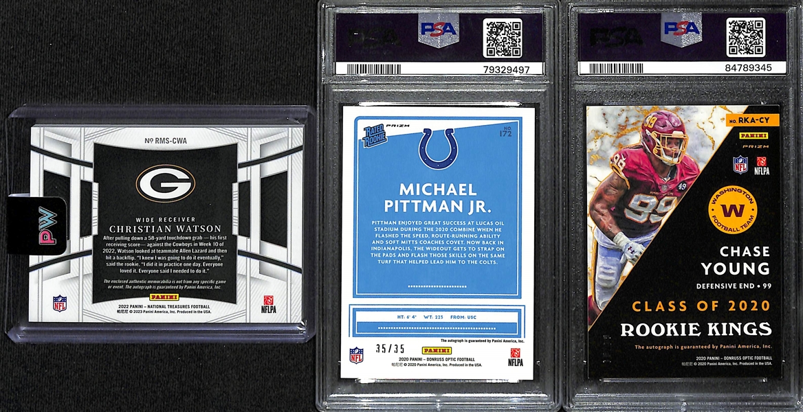 Lot of (3) Football Rookie Autograph Cards- 2022 National Treasures Christian Watson Patch (#/99), 2020 Donruss Optic Michael Pittman Jr Purple (PSA 8) (#/35), 2020 Donruss Optic Chase Young Rookie...