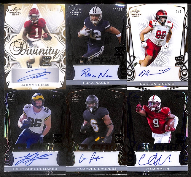 Lot of (18) 2023 Leaf Trinity Football Rookie Autograph Cards including Jahmyr Gibbs (#/10), Puka Nacua (#/99), Dalton Kincaid (#/7), Luke Schoonmaker (#/10), and more