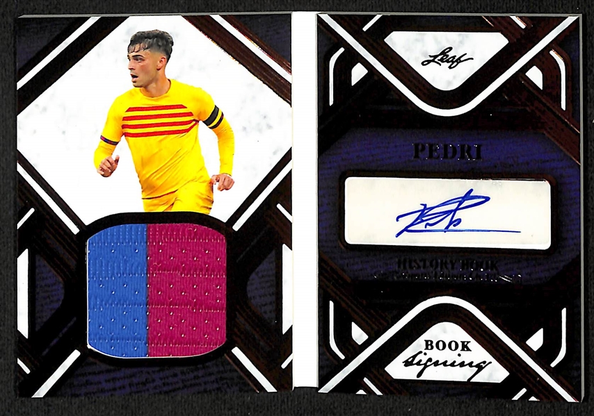 Lot of (3) Soccer Cards - 2023 Leaf History Book Pedri Patch Autograph Booklet (#/25), 2023 Leaf History Book Marcus Rashford Jersey Booklet (#/1), 2023 Leaf Pro Set Pure Jesus Ferreira Autograph...