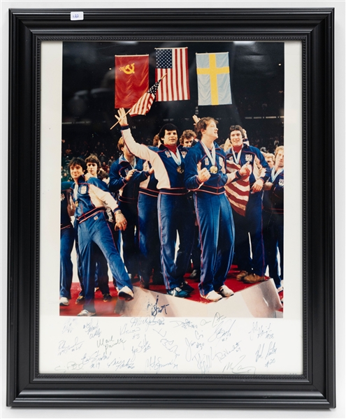 1980 USA Olympic Hockey Team Signed 16x20 Framed Gold Medal Podium Ceremony Team Picture (+JSA Auction Letter)