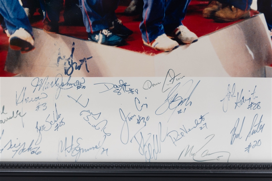 1980 USA Olympic Hockey Team Signed 16x20 Framed Gold Medal Podium Ceremony Team Picture (+JSA Auction Letter)