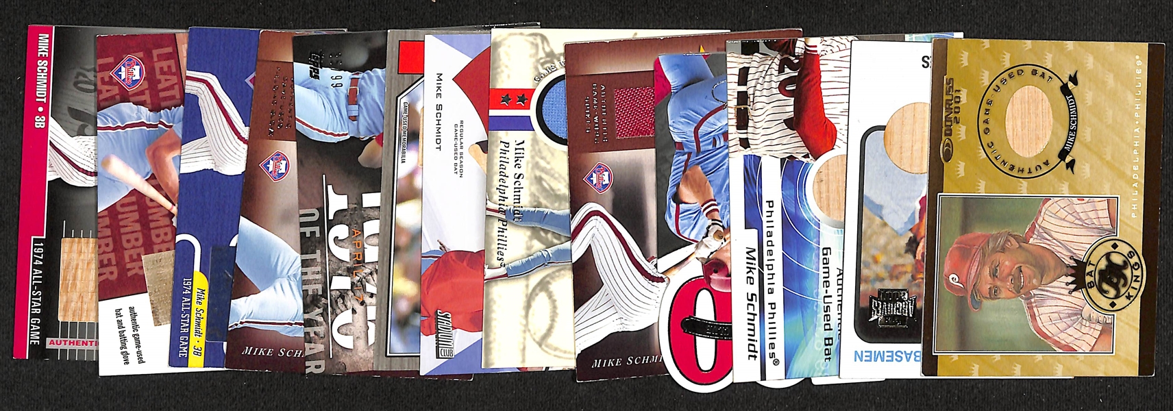 Lot of (13) Mike Schmidt Relic Cards w. Bats, Cleats, Seats, Bench Seats