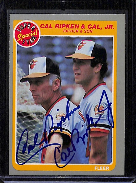 (3) Signed 1985 Fleer Cal Ripken Jr & Sr. (JSA Auction Letter)