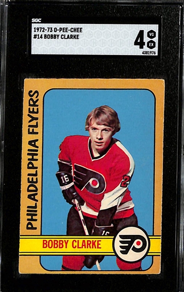 Hockey Card Lot - (2) Graded Bobby Clarke Cards (2nd and 3rd Year OPC) & (2) 1985-86 OPC Mario Lemieux Authentic Rookie Cards (Both Sealed in Permanent Plastic Contact Paper - So Unable to Grade)