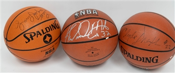 Signed Basketball Lot - Karl Malone, Clyde Drexler, & Larry Johnson Signed Spalding Official Basketballs (Includes JSA Auction Letter)