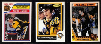 (3) Signed Mario Lemieux Cards - 1985-86 OPC Rookie Scoring Leader #262, 1986-87 OPC #122, 1987-88 Topps All-Star Sticker Card #11 (JSA Auction Letter)